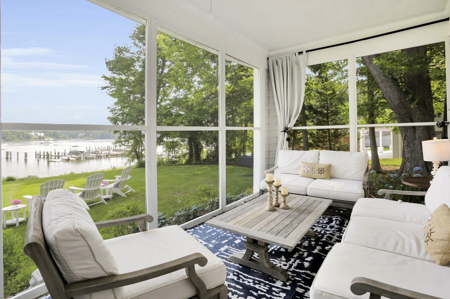 Staged waterfront screened porch