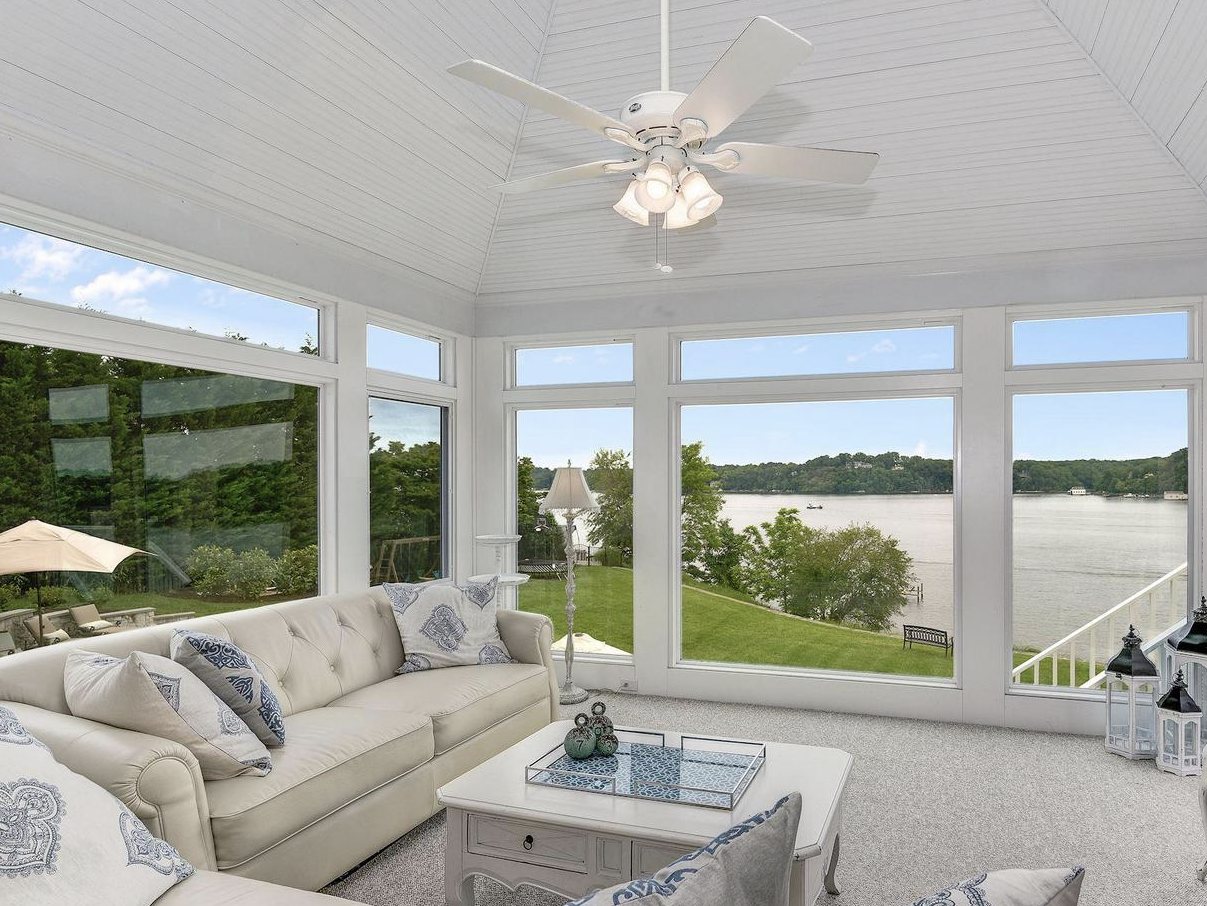 Staged sunroom with bay views